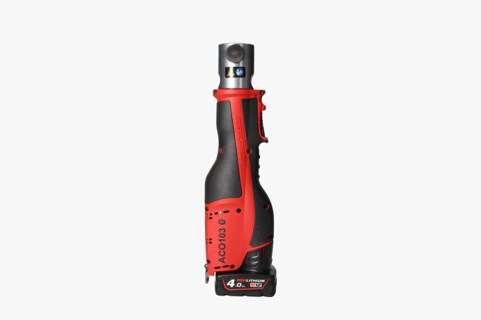Rood-zwarte Novopress accu-persmachine, zijaanzicht